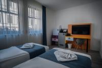 L'hôtel Civitas Sopron - la chambre à deux lits au prix favorable à plus nouvel hôtel de Sopron